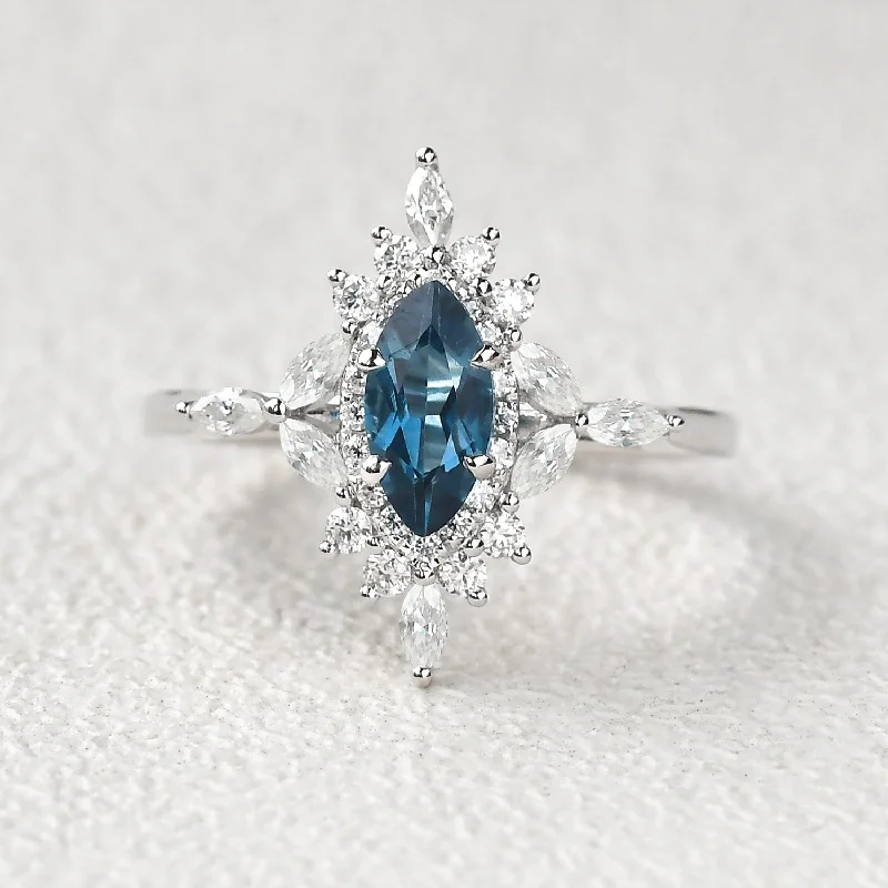 Engagement rings with tension-set peridot stones -1.0ct Marquise Cut London Blue Topaz Cluster Vintage Ring