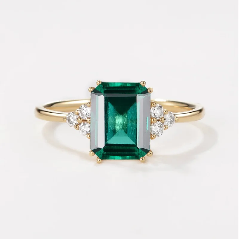 Engagement rings with asymmetrical halo of jade -Emerald Cut Emerald & Moissanite Yellow Gold Ring