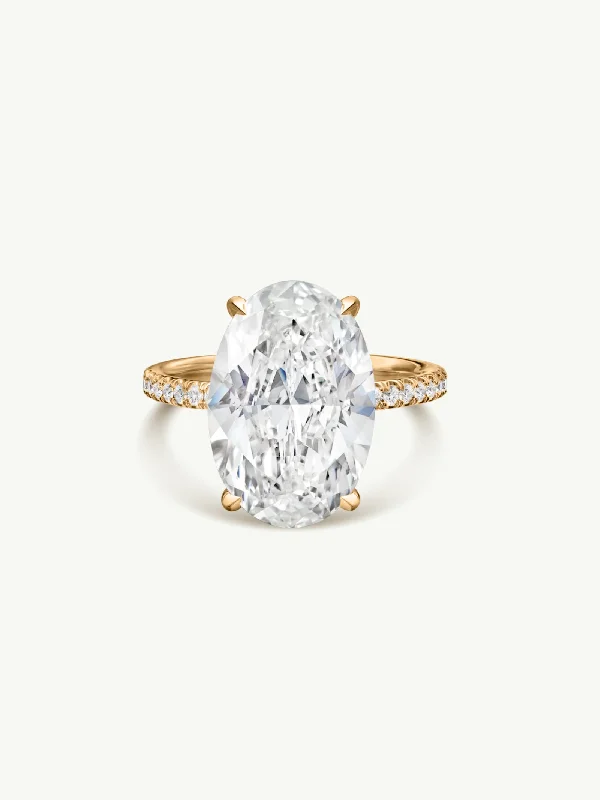 Gold engagement rings with pear-cut sapphire gems -Suma Oval-Shaped Brilliant Cut White Diamond Engagement Ring In 18K Yellow Gold