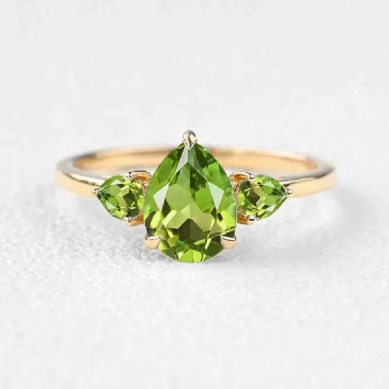 Engagement rings with heart-shaped garnet for love -Pear Peridot Three Stones Engagement Ring