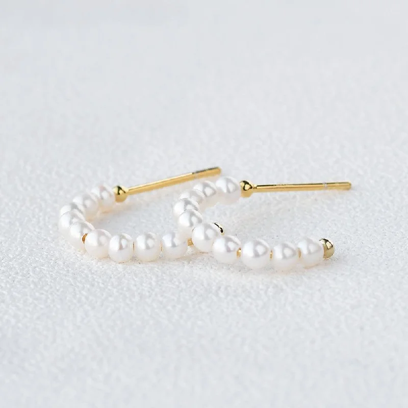 Hoop earrings with colorful beads for a fun and playful vibe-Solid Gold Simple Pearl Huggie Hoops Earrings