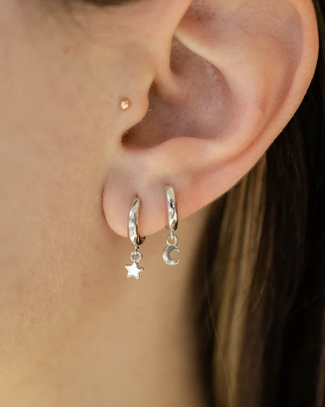 Hoop earrings with diamond-cut surfaces for added sparkle and shine-Star and Moon Huggie Hoop Earrings in Silver